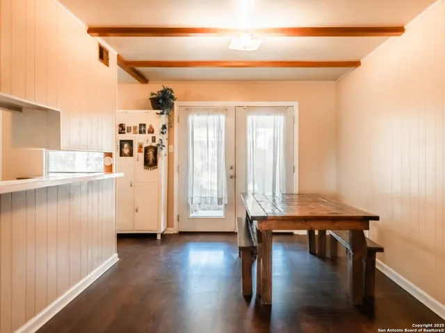 a view of a livingroom with furniture and hardwood floor