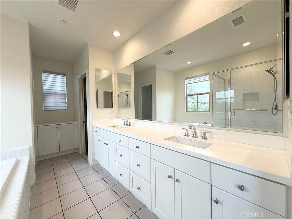 126 Okra Irvine, CA 92618 - Photo 16 of 26 a spacious bathroom with a double vanity sink mirror and