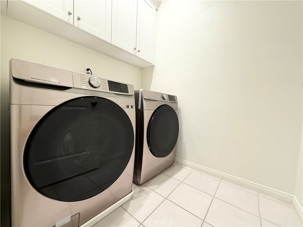 126 Okra Irvine, CA 92618 - Photo 18 of 26 a utility room with dryer and washer