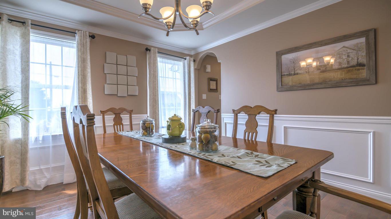 1033 Spring Valley Road Quarryville, PA 17566 - Photo 14 of 33 a view of a dining room with furniture window and wooden floor