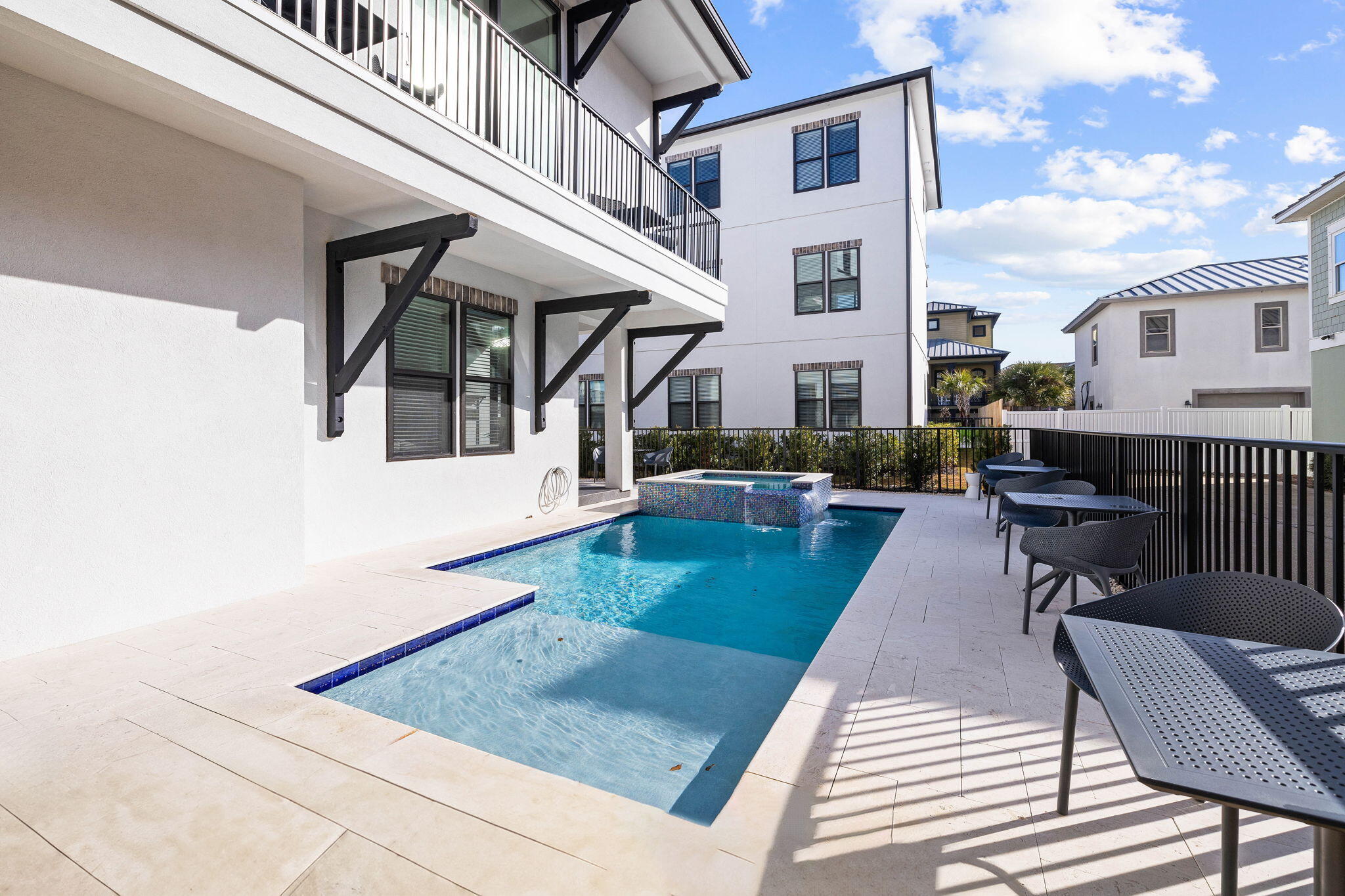 217 Snowdrift Road Miramar Beach, FL 32550 - Photo 16 of 106 a view of a patio with couches table and chairs with wooden floor and fence