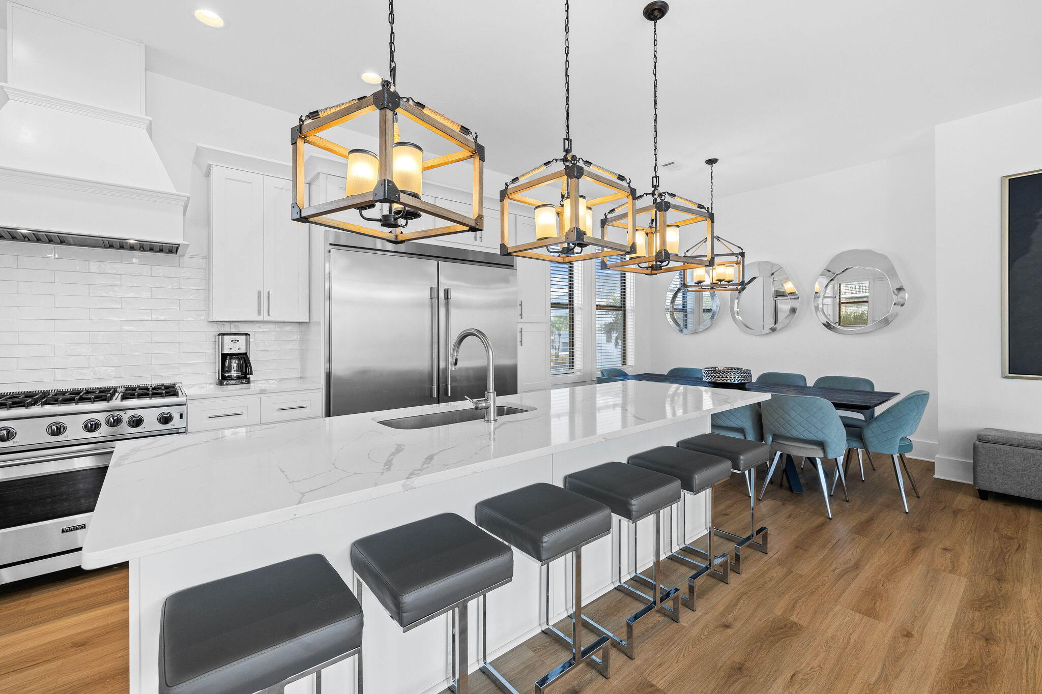 217 Snowdrift Road Miramar Beach, FL 32550 - Photo 57 of 106 a view of a dining room and livingroom with furniture wooden floor a chandelier