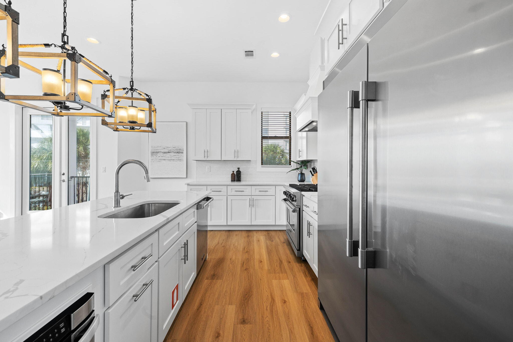 217 Snowdrift Road Miramar Beach, FL 32550 - Photo 58 of 106 a kitchen with stainless steel appliances granite countertop a sink and a refrigerator