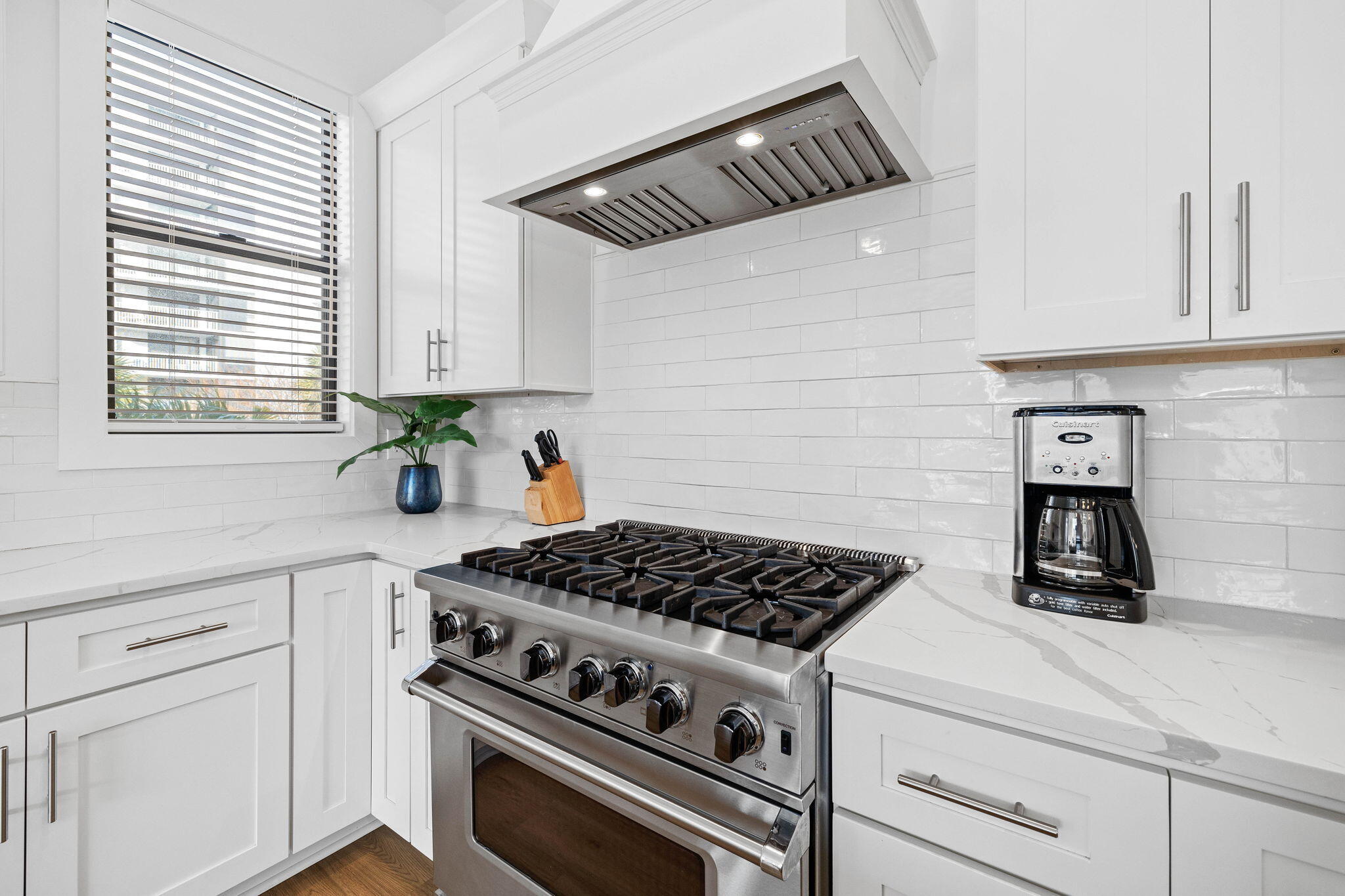 217 Snowdrift Road Miramar Beach, FL 32550 - Photo 59 of 106 a kitchen with white cabinets and appliances