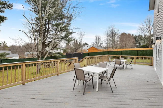 a view of a chairs and table on the deck