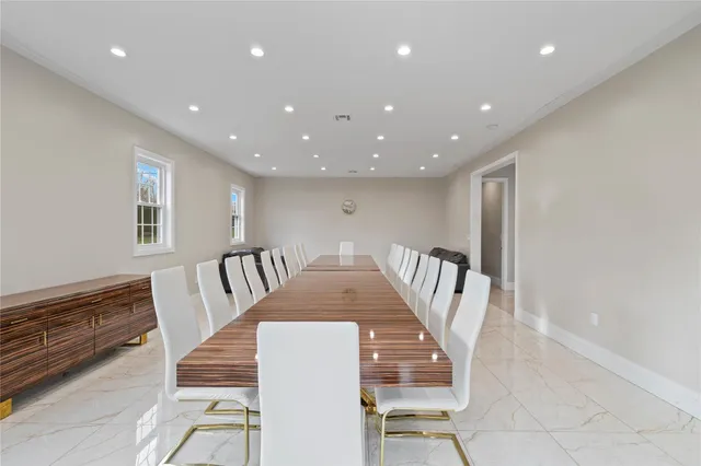 a hallway with a couch and wooden floor