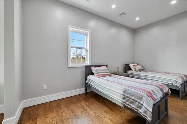 a white toilet sitting next to a window
