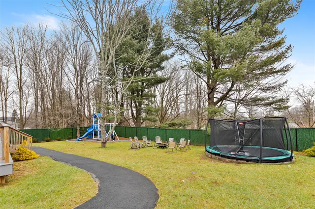 a view of a park with swings and slides
