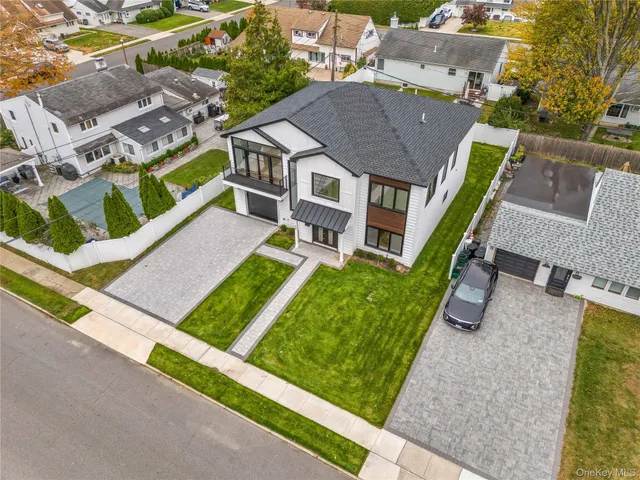 a aerial view of a house with a yard