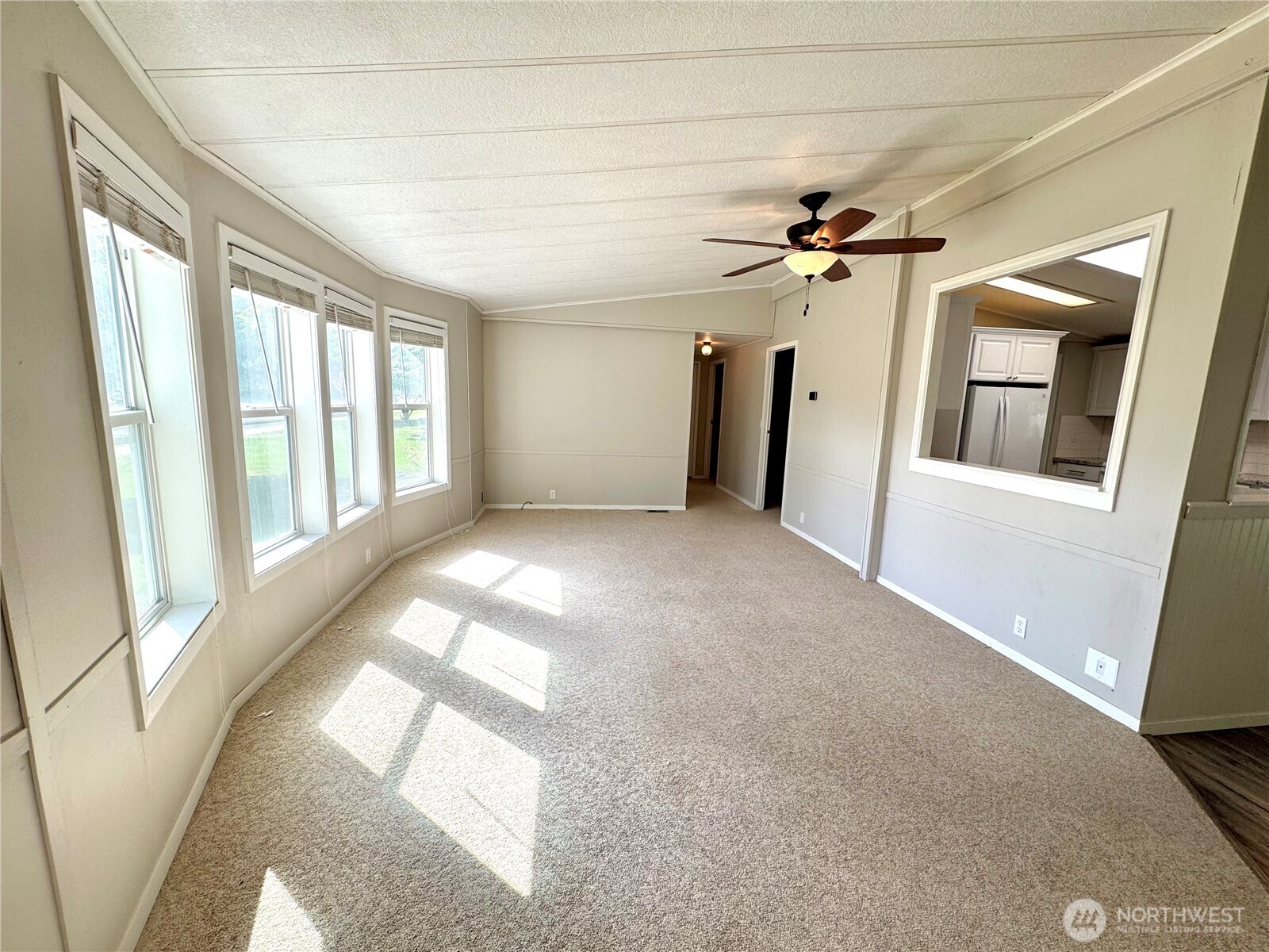 1218 South 3rd Street Dayton, WA 99328 - Photo 7 of 23 a view of a livingroom with a ceiling fan and window