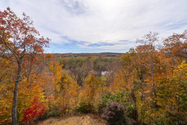 a living room with furniture a table and chairs