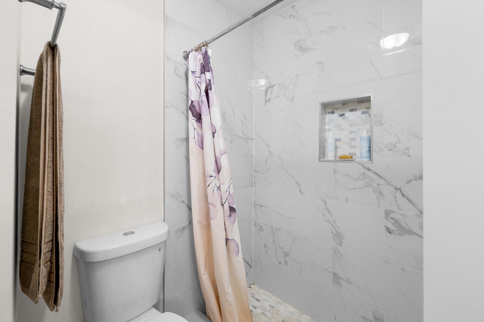 507 Gentian Road St. Augustine, FL 32086 - Photo 27 of 82 a bathroom with a shower and a toilet