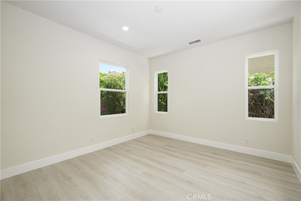 15 Plum Street Ladera Ranch, CA 92694 - Photo 35 of 113 an empty room with wooden floor and windows