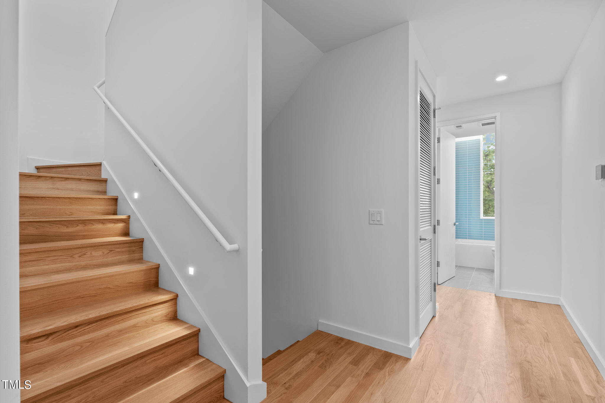 511 South Bloodworth Street, Unit 102 Raleigh, NC 27601 - Photo 16 of 54 a view of entryway and hall with wooden floor