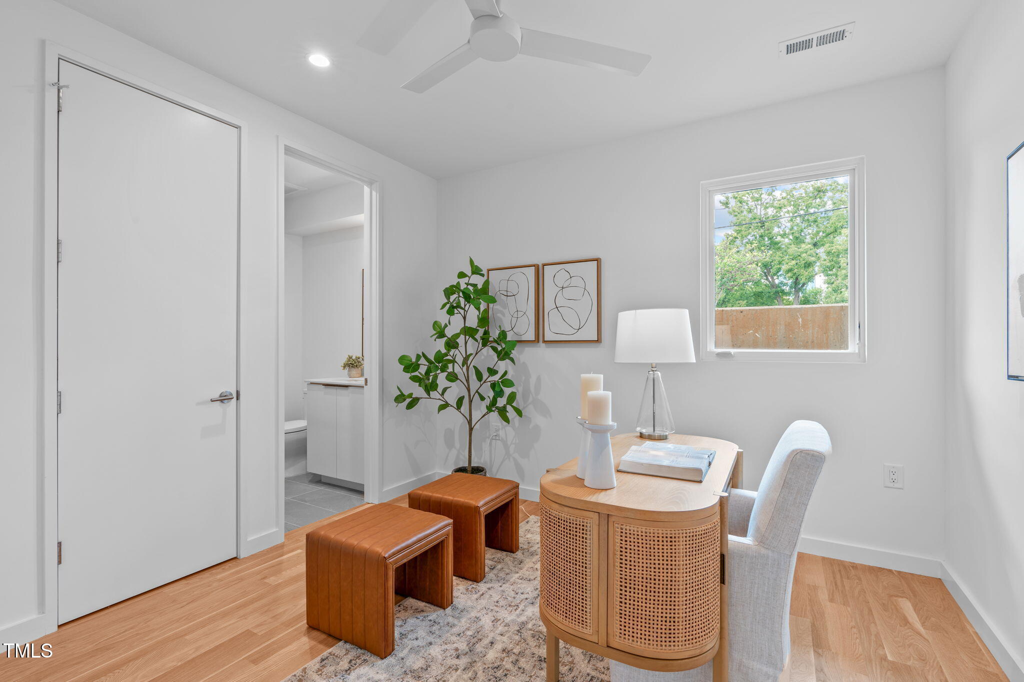511 South Bloodworth Street, Unit 102 Raleigh, NC 27601 - Photo 32 of 54 a living room with furniture and a potted plant