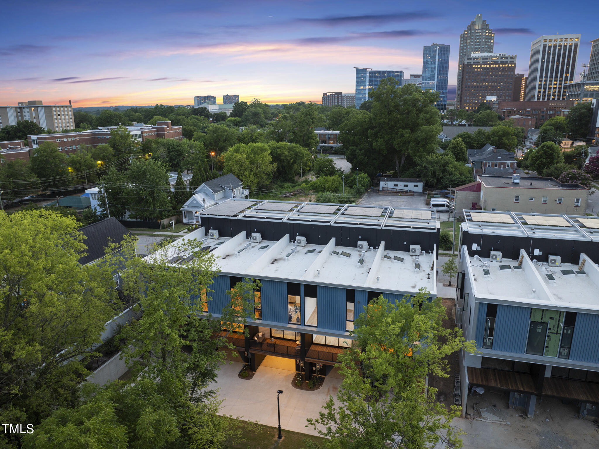 511 South Bloodworth Street, Unit 102 Raleigh, NC 27601 - Photo 39 of 54 an aerial view of multiple houses with a yard