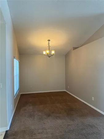 an empty room with a empty space and a window