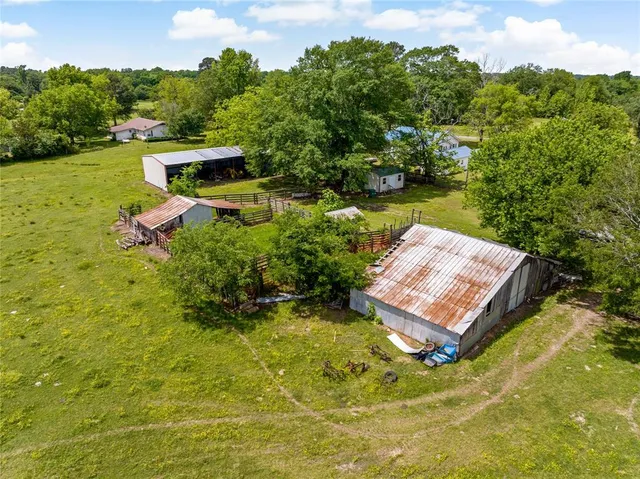 a view of a swimming pool with a yard