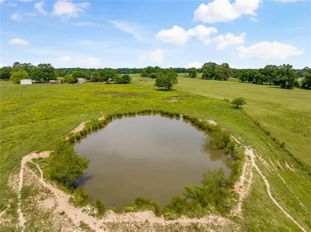 a view of a lake with a big yard
