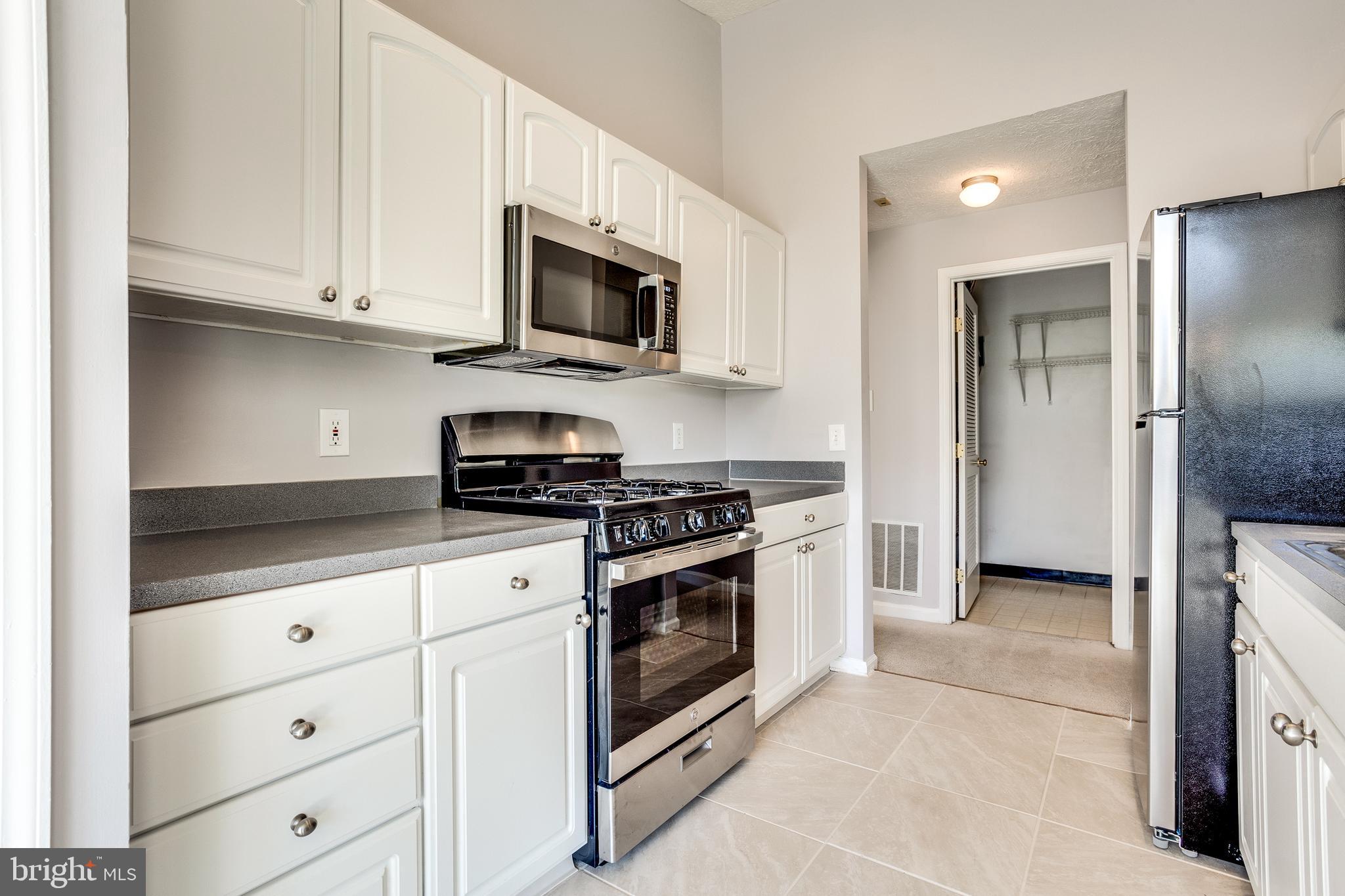 4743 Shellbark Road Owings Mills, MD 21117 - Photo 14 of 28 Kitchen w/ New SS Appliances & Tile Floors