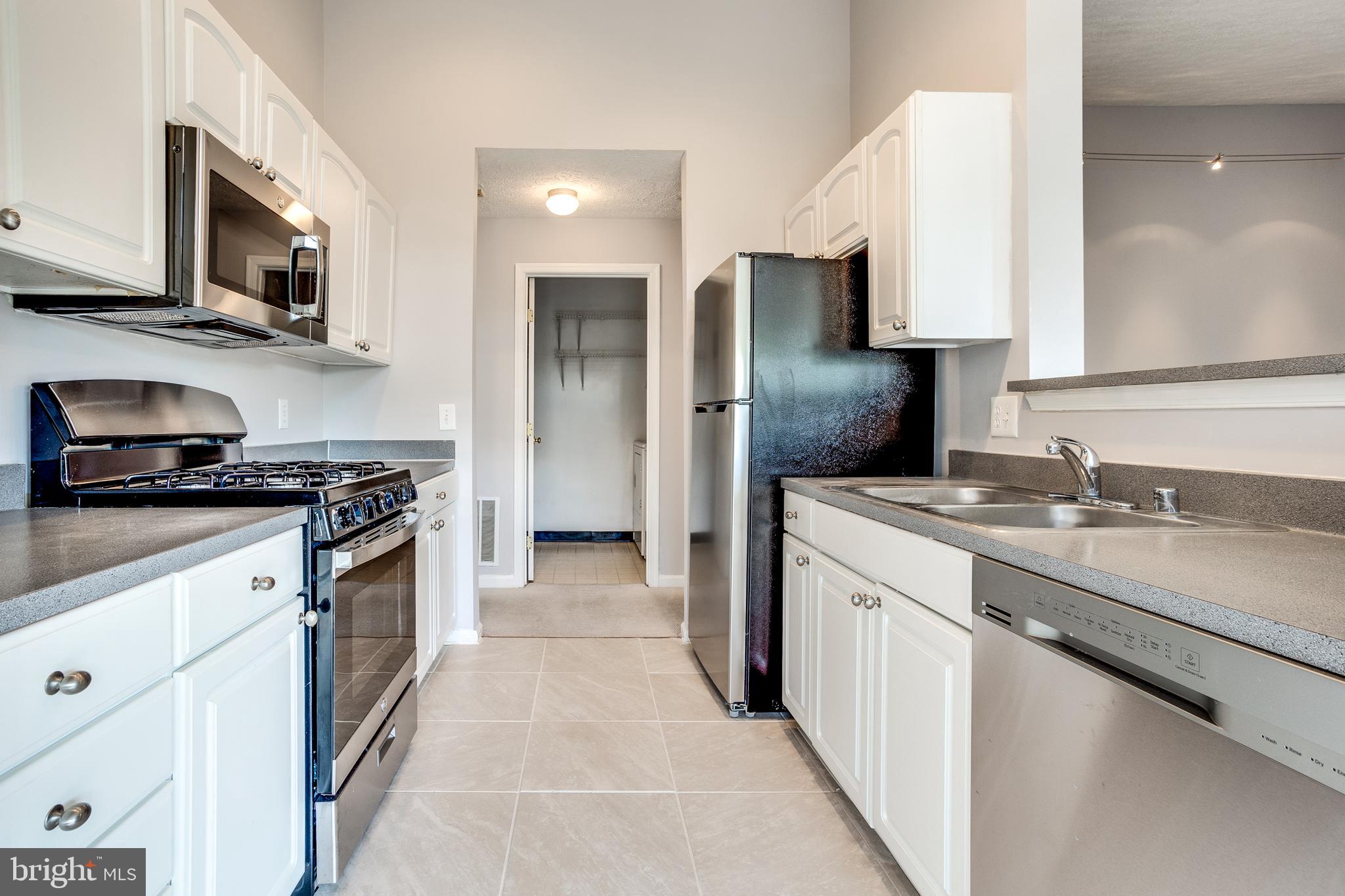 4743 Shellbark Road Owings Mills, MD 21117 - Photo 15 of 28 Kitchen w/ New SS Appliances & Tile Floors