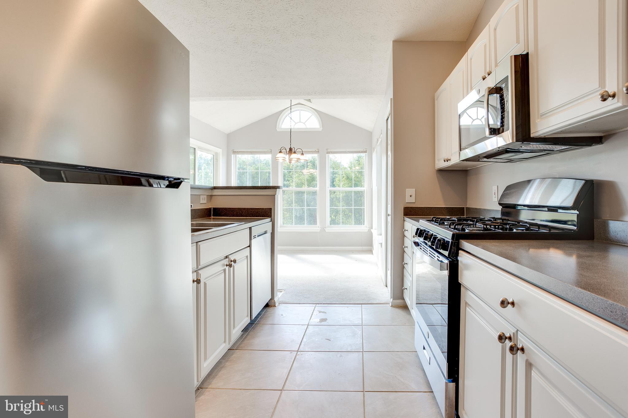4743 Shellbark Road Owings Mills, MD 21117 - Photo 16 of 28 Kitchen w/ New SS Appliances & Tile Floors