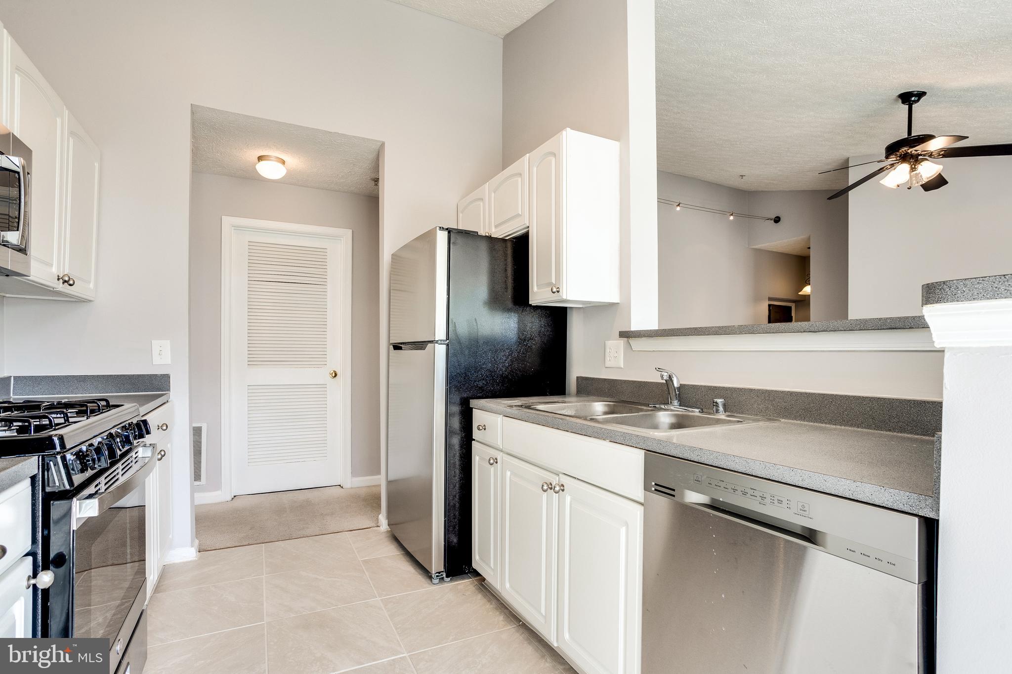 4743 Shellbark Road Owings Mills, MD 21117 - Photo 3 of 28 Kitchen w/ Brand New SS Appls & Tile Flooring