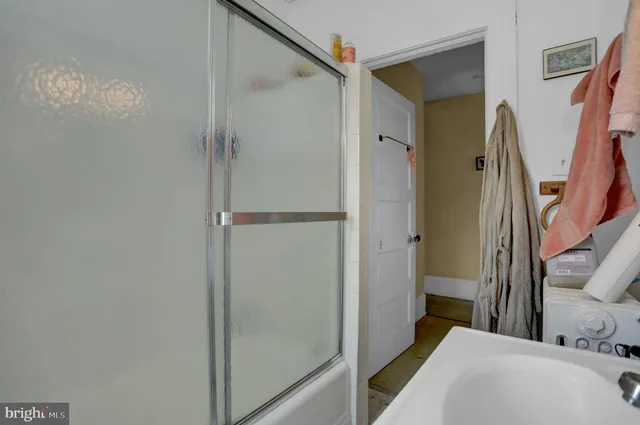 a bathroom with a tub and shower