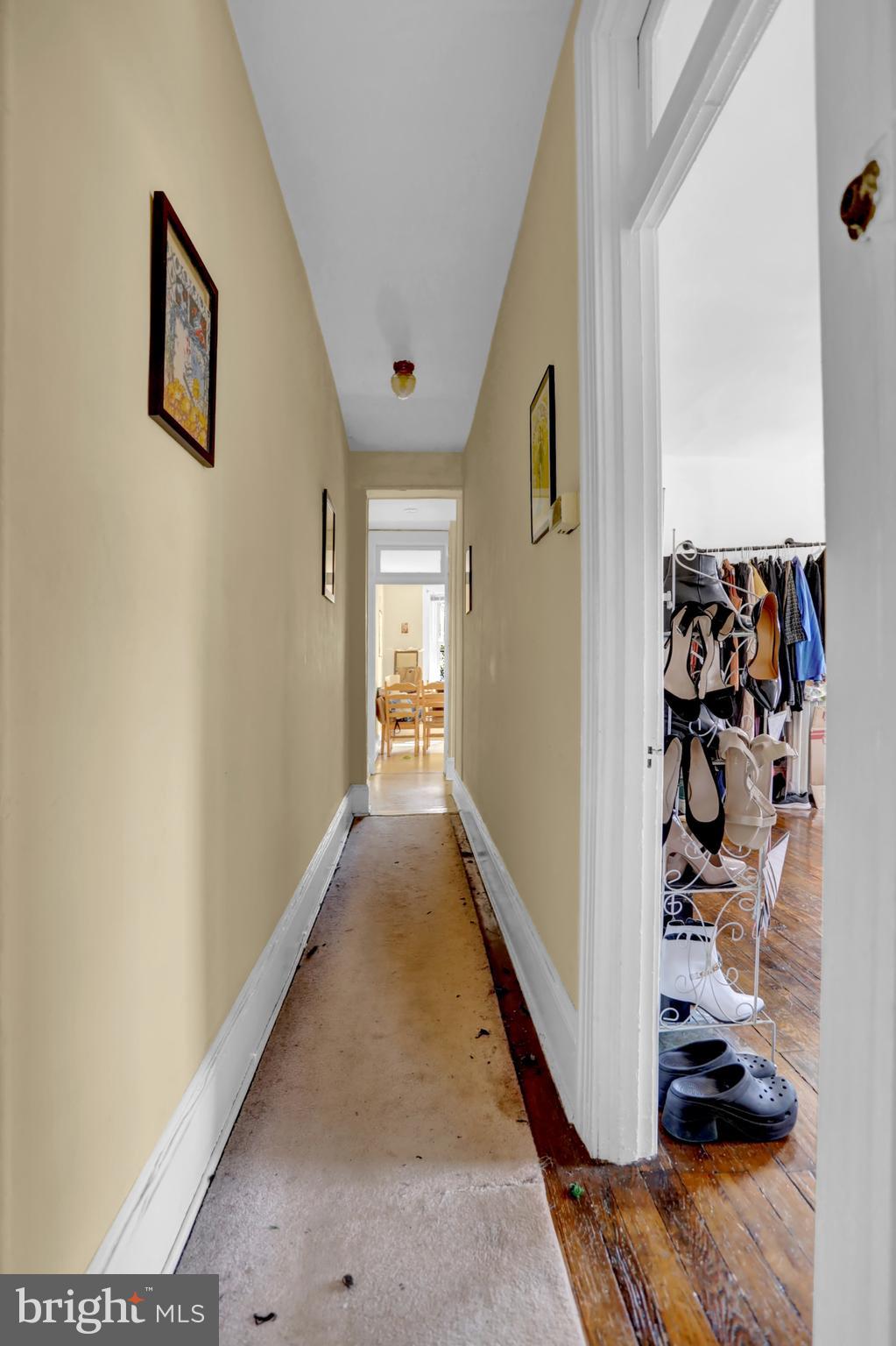 3001 North Calvert Street Baltimore, MD 21218 - Photo 14 of 44 a view of a hallway with wooden floor and closet