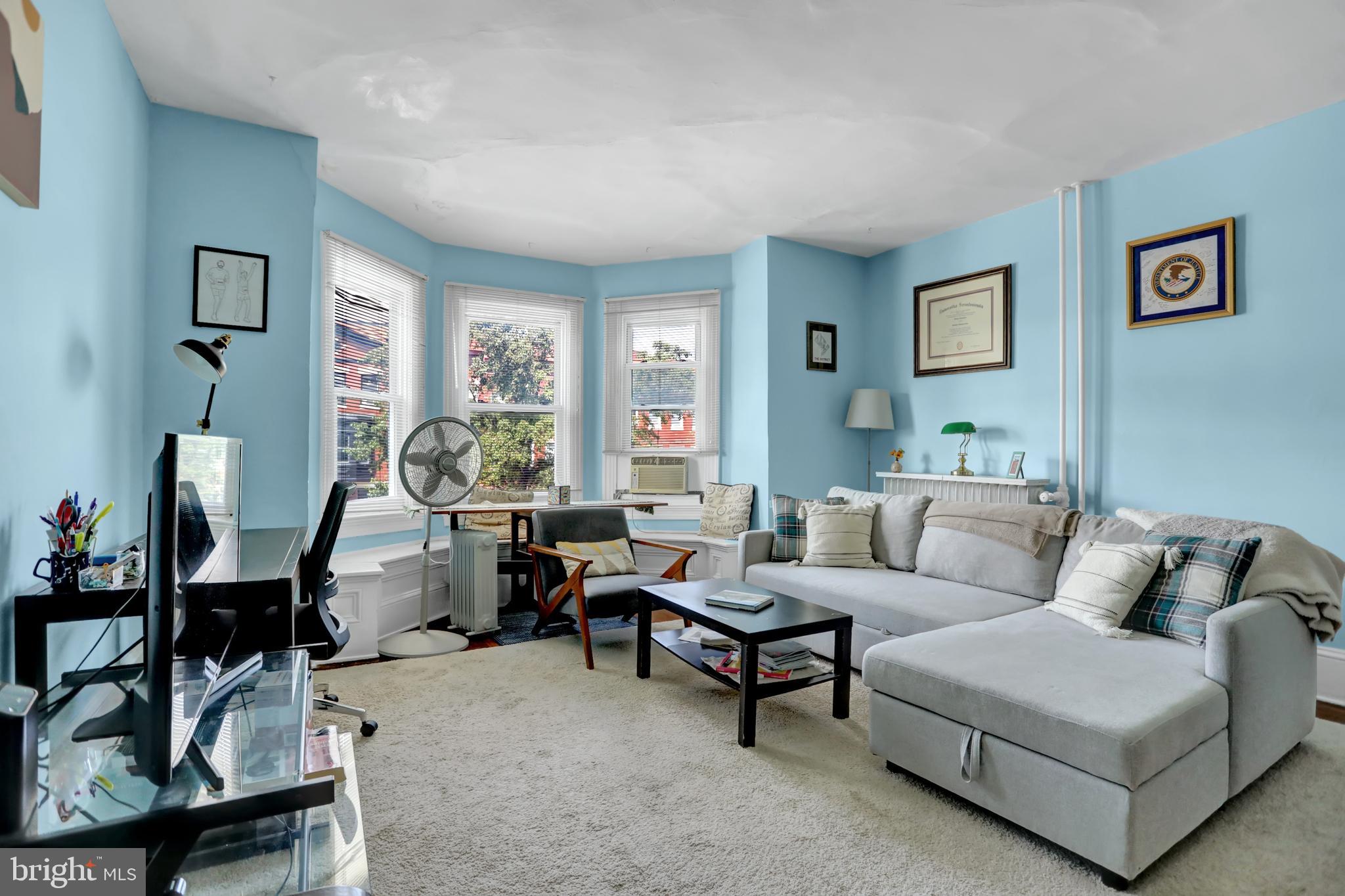 3001 North Calvert Street Baltimore, MD 21218 - Photo 15 of 44 a living room with furniture and a large window