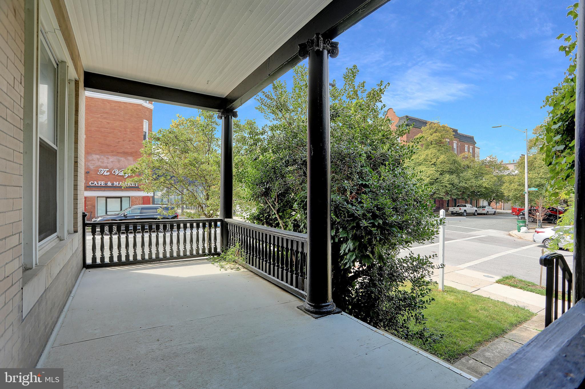 3001 North Calvert Street Baltimore, MD 21218 - Photo 2 of 44 a view of a porch with a yard