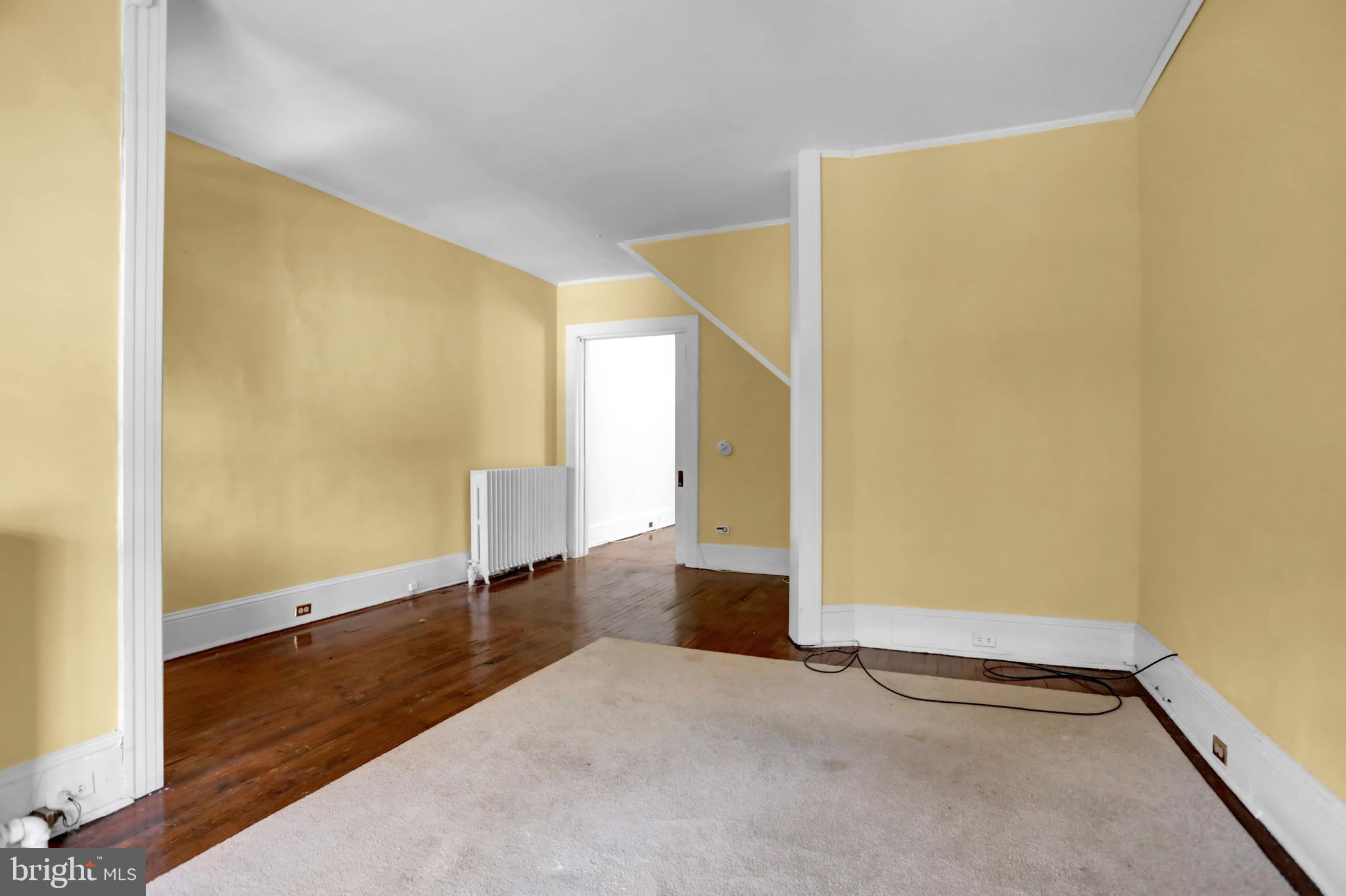 3001 North Calvert Street Baltimore, MD 21218 - Photo 33 of 44 a view of empty room with wooden floor