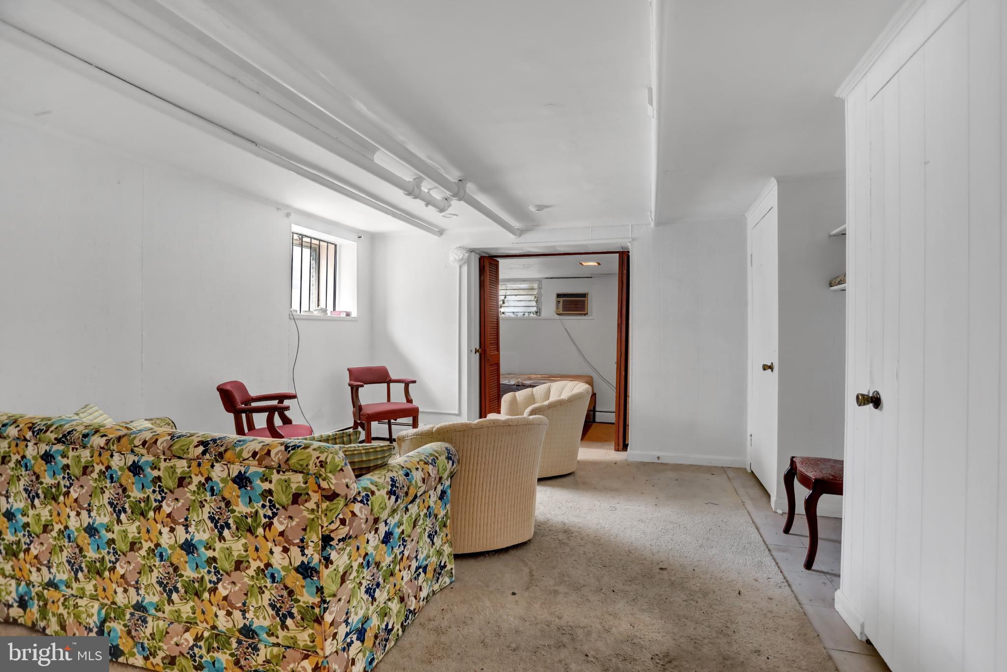 3001 North Calvert Street Baltimore, MD 21218 - Photo 38 of 44 a living room with furniture and a window