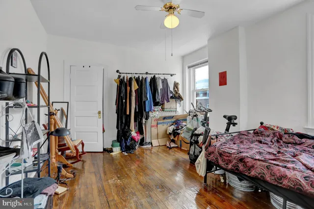 a bed room with a bed and a desk