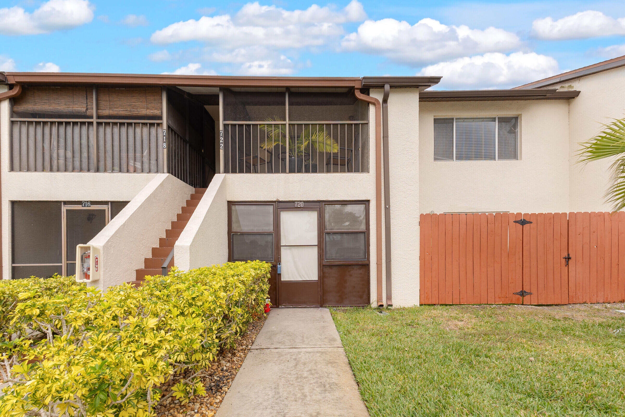 720 Ridge Club Drive, Unit 43 Melbourne, FL 32934 - Photo 1 of 27 a front view of a house with a yard