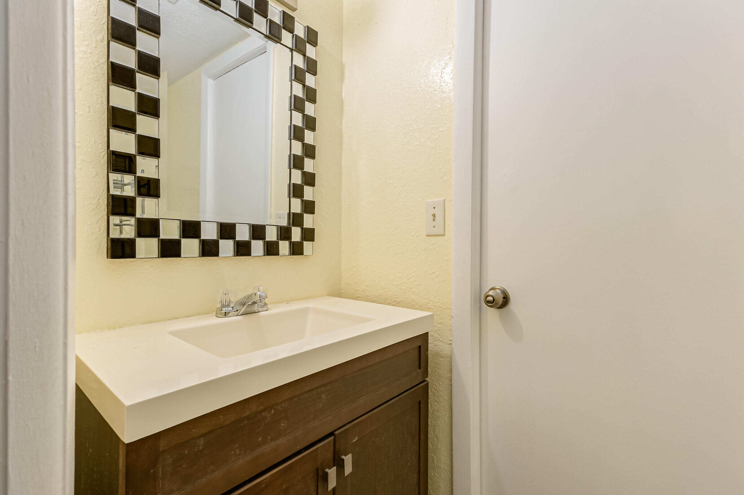 720 Ridge Club Drive, Unit 43 Melbourne, FL 32934 - Photo 17 of 27 a bathroom with a sink and a mirror