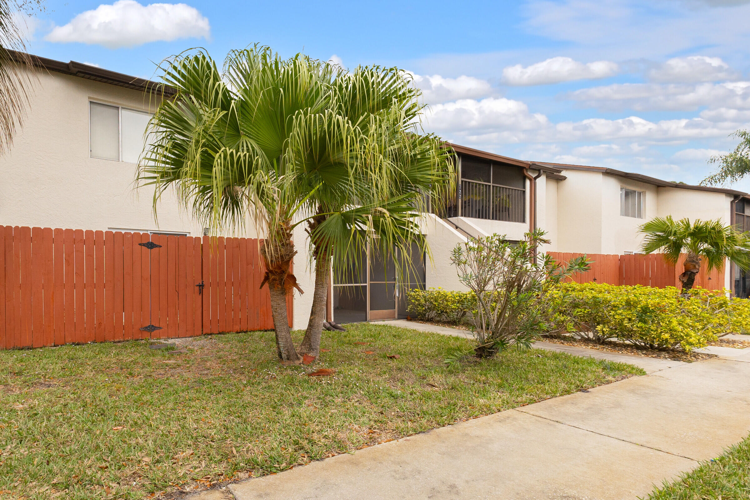 720 Ridge Club Drive, Unit 43 Melbourne, FL 32934 - Photo 7 of 27 a view of a backyard