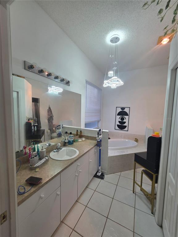 17820 Monteverde Drive Spring Hill, FL 34610 - Photo 30 of 42 a bathroom with a sink a vanity and a mirror
