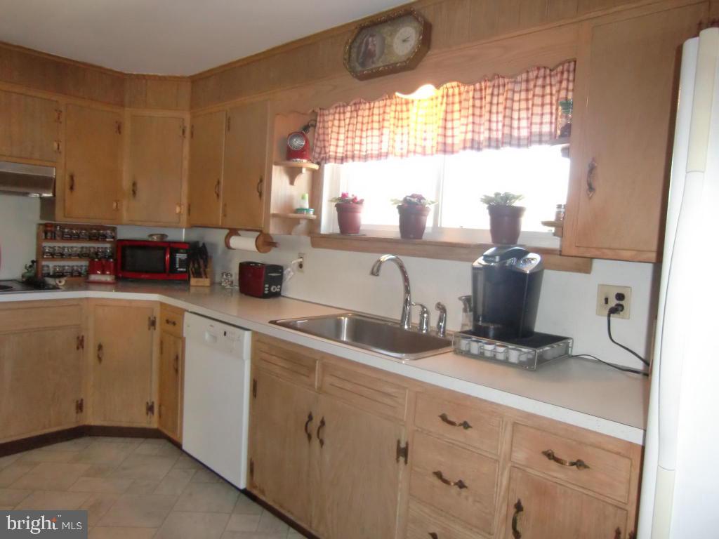 2293 North Colebrook Road Manheim, PA 17545 - Photo 4 of 17 a kitchen with a sink cabinets and window