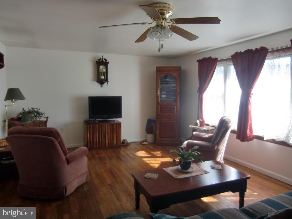 2293 North Colebrook Road Manheim, PA 17545 - Photo 7 of 17 a view of a livingroom with furniture window and wooden floor