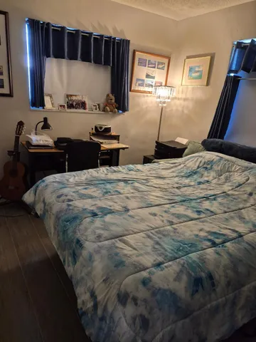 a bedroom with a bed and a cabinets