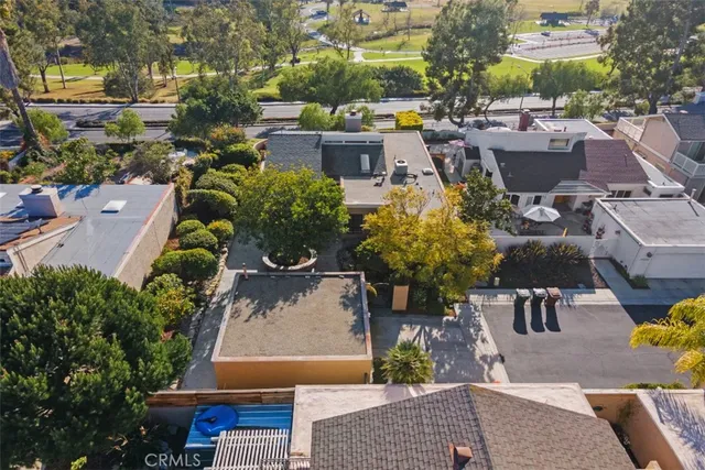 an aerial view of a houses with yard