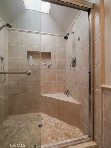 a bathroom with a shower and bathtub