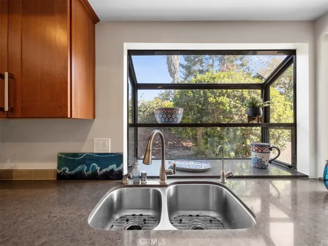 a kitchen with a sink and a window