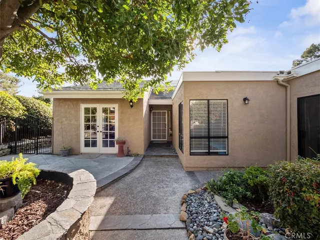 a view of a house with a backyard and porch