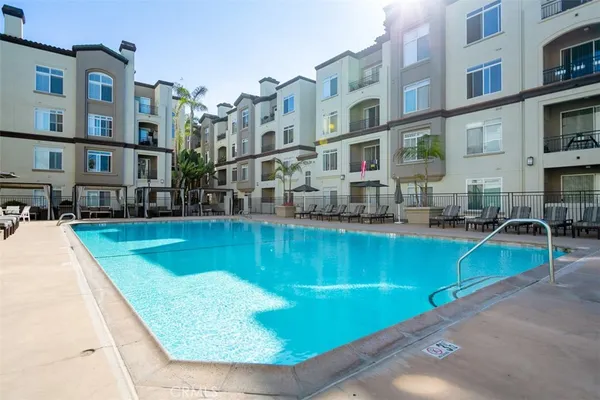 a swimming pool with outdoor seating and yard