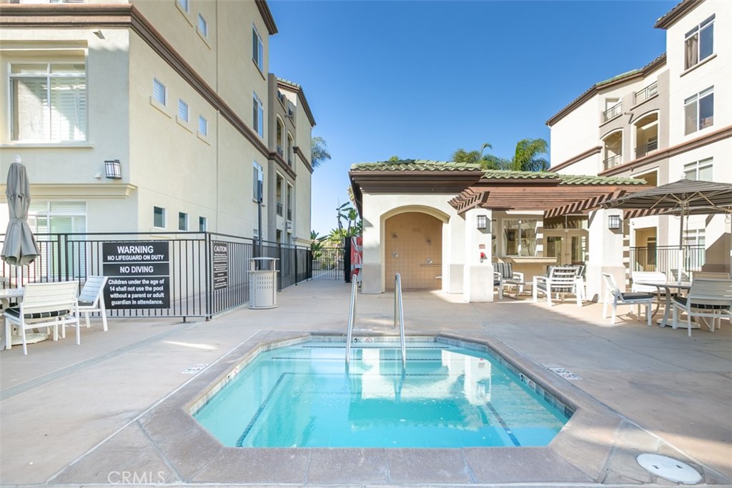 9293 Regents Road, Unit C303 La Jolla, CA 92037 - Photo 13 of 26 a view of a house with a swimming pool