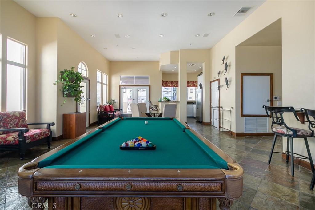 9293 Regents Road, Unit C303 La Jolla, CA 92037 - Photo 16 of 26 a room with pool table and windows