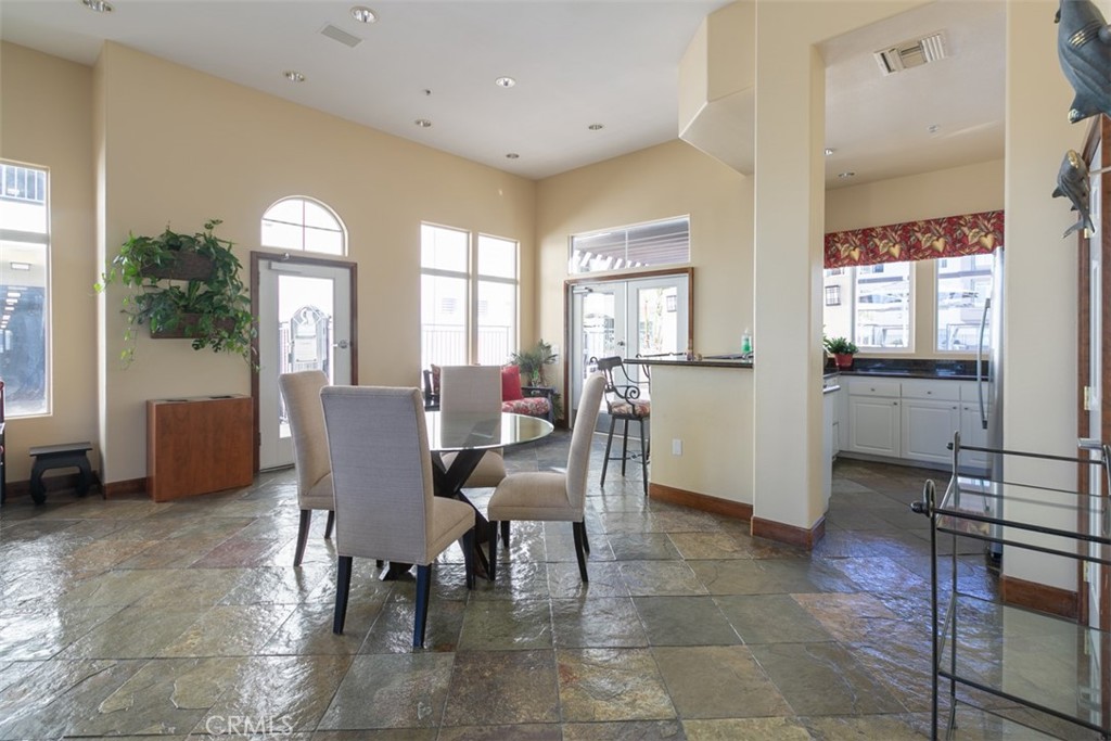 9293 Regents Road, Unit C303 La Jolla, CA 92037 - Photo 20 of 26 a view of a dining room with furniture and a livingroom