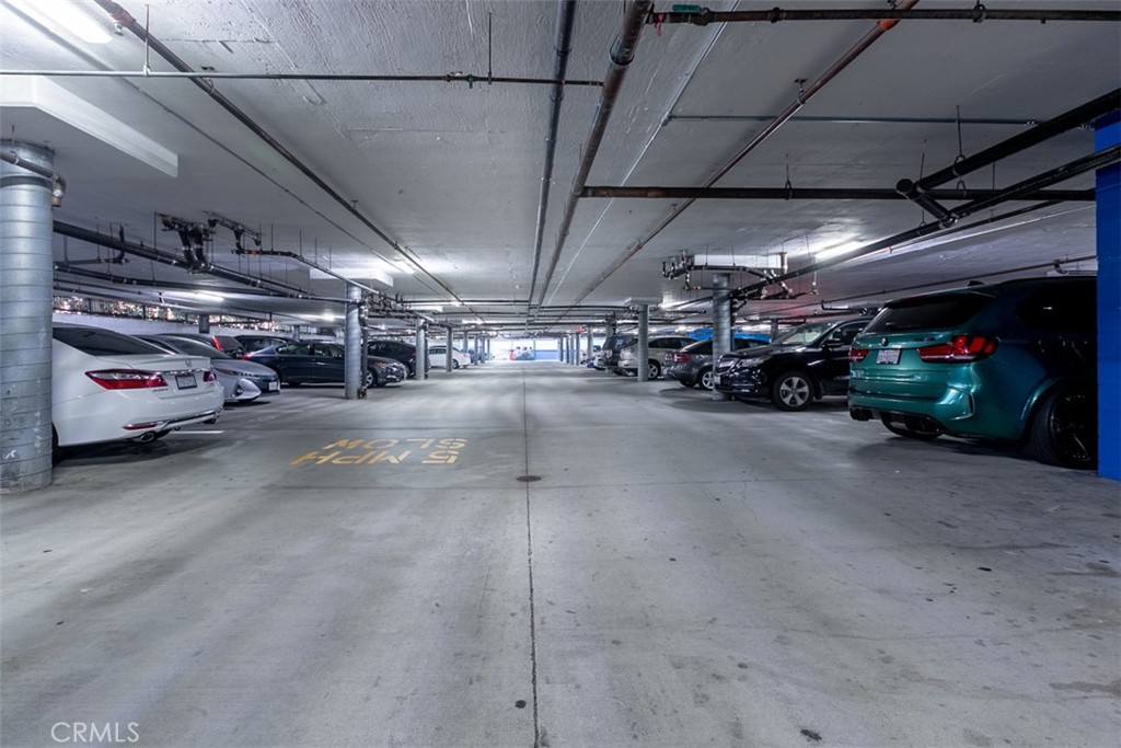 9293 Regents Road, Unit C303 La Jolla, CA 92037 - Photo 23 of 26 a view of parking garage with cars